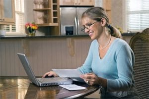 woman spending extra money to pay off debt